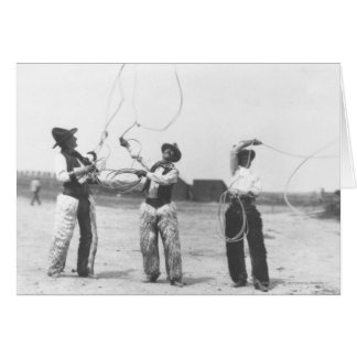 Three men lassoing.