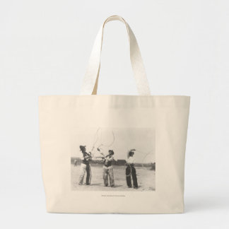 Three men lassoing. large tote bag