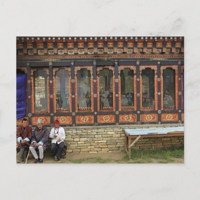 Three men sit on a bench at the Memorial Chorten Postcard (Front)