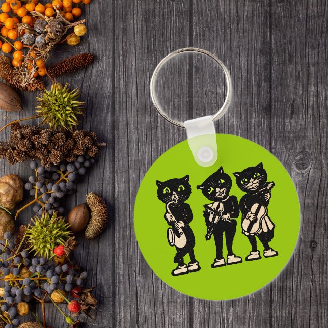 Three Musical Cats Keychain (Three black cat musicians playing musical instruments green eyes on green keychain.)