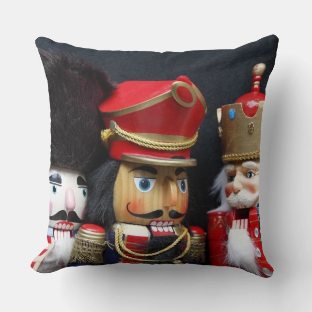 Three nutcrackers on black throw pillow (Front)