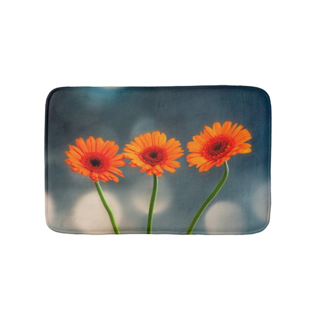 Three Orange Gerberas in a Row Bath mat (Front)