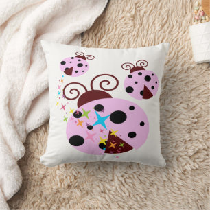 Three pink and black ladybug with stars cushion