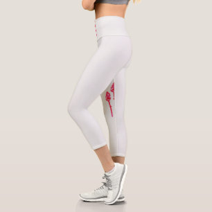 Three pink flowers with a black background capri leggings