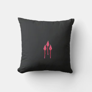 Three pink flowers with a black background cushion