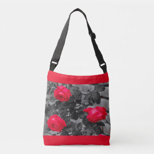 Three roses wetted by the rain on cross body bag