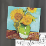 Three Sunflowers | Vincent van Gogh Magnet<br><div class="desc">Three Sunflowers (1888) by Vincent van Gogh is a vibrant still life that showcases the artist’s signature thick brushstrokes and bold use of color. The painting features three sunflowers in a simple vase, their golden petals contrasting against the aqua blue background. Van Gogh's vivid yellow palette brings energy and life...</div>