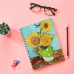 Three Sunflowers | Vincent van Gogh Notebook<br><div class="desc">Three Sunflowers (1888) by Vincent van Gogh is a vibrant still life that showcases the artist’s signature thick brushstrokes and bold use of colour. The painting features three sunflowers in a simple vase, their golden petals contrasting against the aqua blue background. Van Gogh's vivid yellow palette brings energy and life...</div>