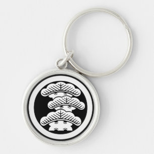 Three-tiered pine R in circle Key Ring
