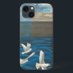 Three White Seagulls Flying Over the Water iPhone 13 Case<br><div class="desc">Need to get away? Do it by choosing this painting by artist Tara Friel representing three seagulls flying over the water. The sight of the waves of the ocean and the vivid colours make this design very realistic.</div>