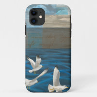 Three White Seagulls Flying Over the Water