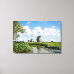 Three windmills and a canal canvas print