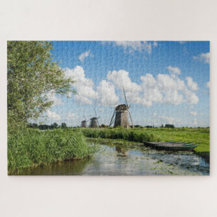 Three windmills and a canal with boats jigsaw puzzle