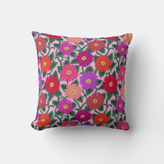 Throw pillow with pink and red daisy print