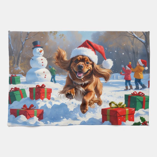 Tibetan Spaniel Running in Snow with Christmas Hat Tea Towel (Horizontal)
