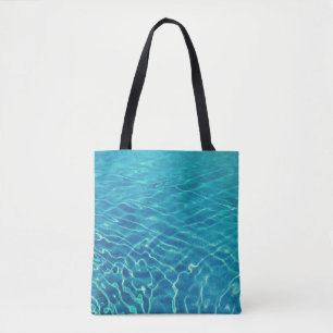 Time lapse photography of blue body of water tote bag