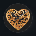 Timeless Golden Heart Symbol of Love Round Clock<br><div class="desc">A timeless golden heart design that symbolizes love,  devotion,  and warmth. Flowing ornamental shapes and rich metallic tones make this artwork a beautiful choice for meaningful gifts,  anniversaries,  weddings,  and special occasions.</div>
