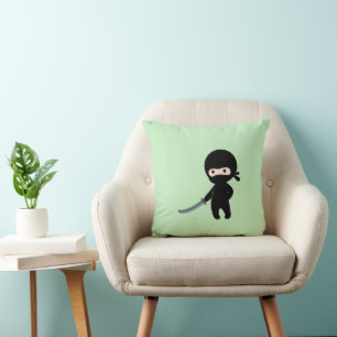 Tiny Angry Ninja on Green Cushion
