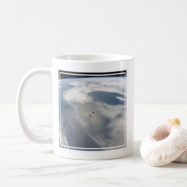Tiny Satellites Orbit Above A Part Of Earth. Coffee Mug (With Donut)
