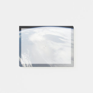 Tiny Satellites Orbit Above A Part Of Earth. Post-it Notes