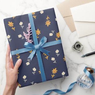 Tiny yellow and cream flowers on navy blue wrapping paper
