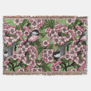 Tit birds in the lilac garden throw blanket