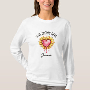 🔹 Title  Love Grows Here – Sunflower Heart Typogr T-Shirt