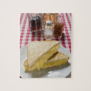 Toasted cheese sandwiches on plate, vinegar, jigsaw puzzle
