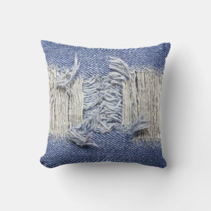 Torn blue denim: jeans texture. cushion