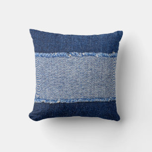 Torn denim: blue jeans fabric. cushion