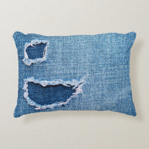 Torn denim fabric texture, blue hues. decorative cushion