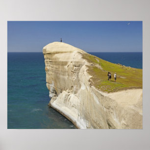 Tourists on cliff top at Tunnel Beach Poster
