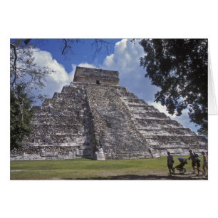 Tourists walk past an unrestored side of El 2