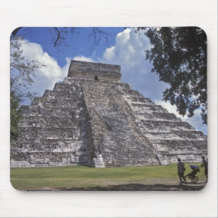 Tourists walk past an unrestored side of El 2 Mouse Pad