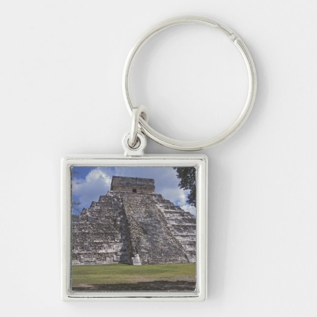 Tourists walk past an unrestored side of El Key Ring (Front)
