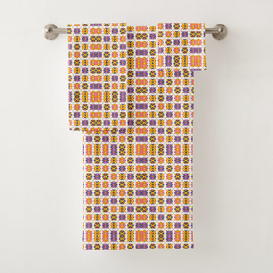 Towel and washcloth set with colorful geometric 