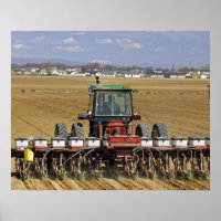 Tractor pulling a seed corn planter.