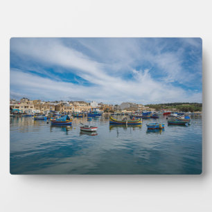 Traditional colorful fishing boats in the harbor plaque