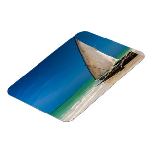 Traditional fishing boat on the beach magnet