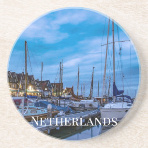 Traditional fishing town night scene coaster