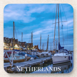 Traditional fishing town night scene coaster