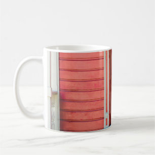 Traditional red painted wooden door and porchdoor, coffee mug