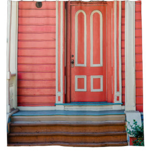 Traditional red painted wooden door and porchdoor, shower curtain