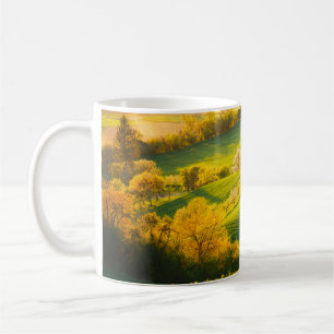 Tranquil rural landscape in sunbeams. Beautiful su Coffee Mug