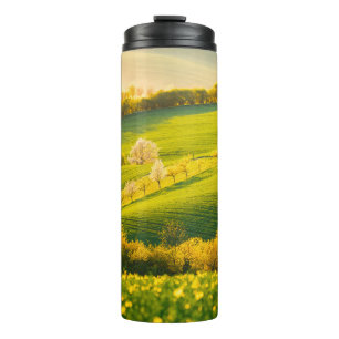 Tranquil rural landscape in sunbeams. Beautiful su Thermal Tumbler