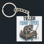 Trash Fishin' Expert Raccoon Key Ring<br><div class="desc">Are you a fan of raccoons and fishing? This funny 'Trash Fishin' Expert' design features a master raccoon angler on a wooden dock with his gear. Perfect for anyone who loves trash panda memes, outdoor fishing trips, and a good laugh. This vintage-style illustration is a great gift for fishers, outdoorsmen,...</div>