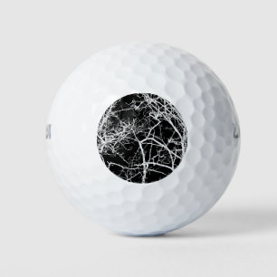 Tree branches on black background golf balls