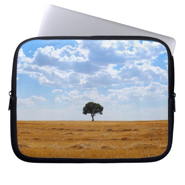 Tree in an harvested wheat field  laptop sleeve (Front)