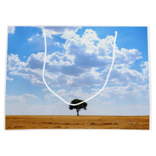 Tree in an harvested wheat field large gift bag