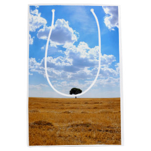 Tree in an harvested wheat field medium gift bag